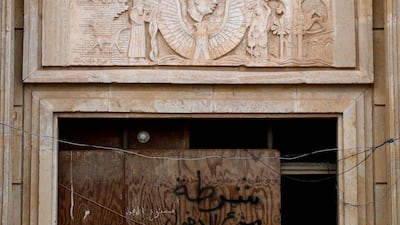 A portrait of Saddam can be seen on one of his palaces in the Babylon Tourist Resort. Graffiti in Arabic reads "not entry".