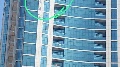 An image of Farouq Mohammad, 5, dangling from the window of the Sharjah residential tower he lives in. Photo: Supplied