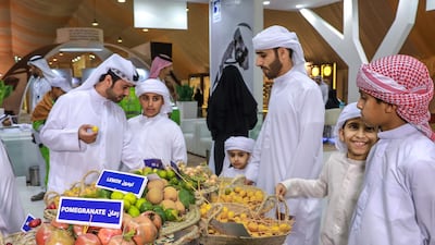 Visitors inspect some of the other fruit on display at the Liwa Date Festival. Victor Besa / The National