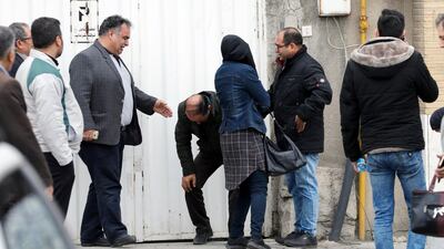 A man is overcome by emotions as a group of relatives of passengers of an Iran Aseman Airline flight gathers around a mosque at the Mehr-Abad airport in Tehran, Iran. Abedin Taherkenareh / EPA