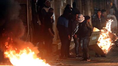 Palestinians build a burning barricade as they clash with Israeli security forces during a protest against US President Donald J. Trump's Middle East peace plan to solve the conflict between Palestinians and Israel, near the West Bank City of Hebron. EPA