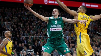 Richard Hendrix, right, of Maccabi Electra Tel Aviv is challenged by Mantas Kalnietis , left, from Lithuania's BC Zalgiris during the top 16 Euroleague basketball match against BC Zalgiris in Kaunas, Lithuania, Thursday, Jan. 19, 2012. (AP Photo/Mindaugas Kulbis)