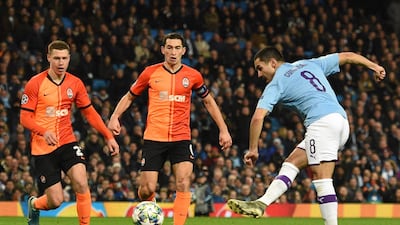 Manchester City midfielder Ilkay Gundogan scores the opening goal during the UEFA Champions League match against Shakhtar Donetsk at the Etihad Stadium. AFP