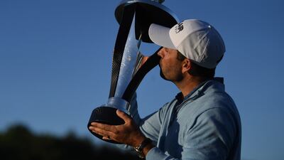 Charl Schwartzel of South Africa celebrates with the trophy after winning the inaugural LIV Golf Invitational Series event at the Centurion Golf Club, St Albans, UK, on June 11, 2022. EPA