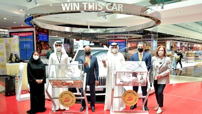 Dubai Duty Free officials announce the latest winners from the draws.