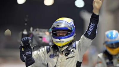 German driver Nico Rosberg of Williams celebrates after coming second in F1's first-ever night race at the Singapore Grand Prix on September 28, 2008.