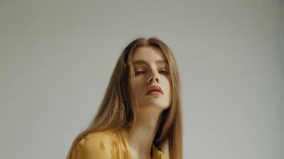 LADY IN WAITING: Pattern dress, Dh28,000; long-sleeve dress (worn underneath), Dh15,000; shoes, Dh4,800, all from Christian Dior