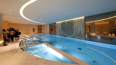 The inside swimming pool of the Peninsula Paris has a zen design and features a ceiling-to-floor waterfall. Benoit Tessier / Reuters