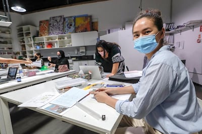 Sayyora Bobokulova does some last-minute measurements before her presentation at The Designers' Studio in Abu Dhabi. Victor Besa / The National Section