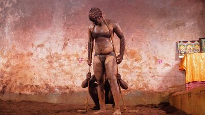 Sachin Salunkhe drags Mr Mane's 20-year-old son Shankar in one of the training exercises. Sanket Jain for The National