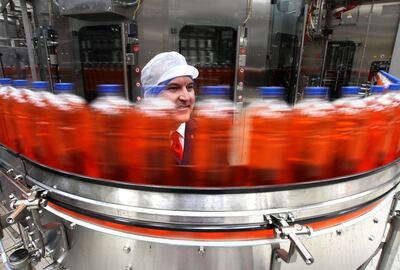 Mark Jephcott viewing bottles of Irn Bru at AG Barr's Irn Bru factory in Cumbernauld. The compny struggled to make deliveries of its drinks due to the lorry driver and supply chain issues. PA
