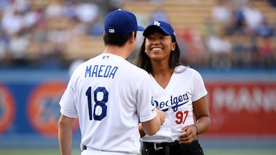 Osaka of Japan laughs with the LA Dodgers' Kenta Maeda. AFP