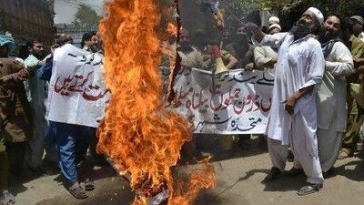 Pakistan Muthidda Shehri Mahaz activists burn the US flag during a protest in Multanagainst US drone attacks. Relations between the US and Pakistan is tense as Washington loses patience with Islamabad for not opening Nato supply routes.