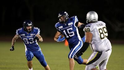 Barracudas player Daniel Viranyi, centre, in action during the Desert Bowl. Chris Whiteoak / The National