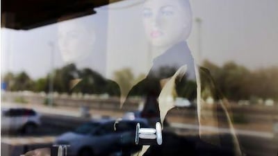 Fashion designers often replicate designs made by others. Above, a reflection of a mannequin in abaya. Lee Hoagland / The National