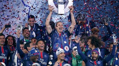 Zlatan Ibrahimovic lifts the Ligue 1 title. Yoan Valat / EPA