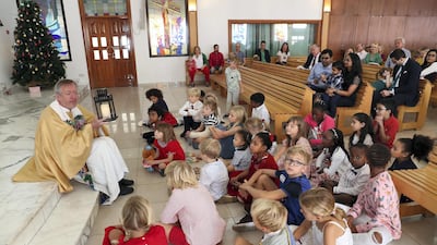 Rev Jim Young with young members of his congregation.