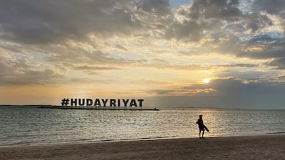 Lifeguard watches over the Hudayriyat beach amid the chilled weather in Abu Dhabi. Talib Jariwala / The National