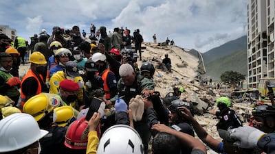 The search and rescue operation continues after Venezuela was hit by two strong earthquakes last week. Here, a person is pulled alive from the rubble of a collapsed building in Caraballeda, La Guaira. AFP