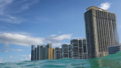 Waves lap ashore near condo buildings on the day the United Nations released a report with a dire warning for humanity on August 09, 2021 in Sunny Isles, Florida. Getty Images via AFP