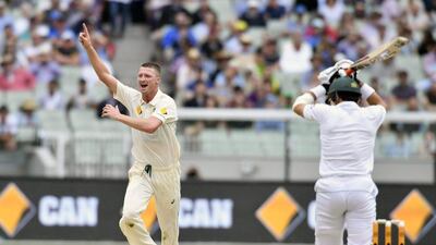 Jackson Bird, left, celebrates the wicket of Misbah-ul-Haq, right, on the first day of the Test in Melbourne. Andy Brownbill / AP Photo
