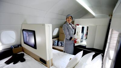 An Etihad Airways official stands inside a mock-up first class cabin, at a training facility in Abu Dhabi. Etihad Airways, a fast-growing Mideast carrier, laid out plans to offer passengers who find first-class seats a bit too tight a miniature suite featuring a closed-off bedroom, private bathroom and a dedicated butler. Kamran Jebreili / AP Photo