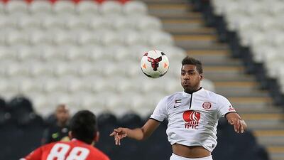 Khamis Esmail, in white, signed a three-year deal with Al Ahli on Monday night for an undisclosed fee to bring his five-year association with Al Jazira to an end. Ravindranath K / The National