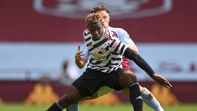 United midfielder Paul Pogba is challenged by Villa's Matty Cash. EPA