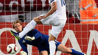 England’s Harry Kane puts in a shot that causes an own goal from keeper Giedrius Arlauskis on Monday night during their Euro 2016 qualifying match. Janek Skarzysnki / AFP