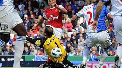 Andrey Arshavin, centre, beats Paul Robinson in the Blackburn goal to score Arsenal's winning goal at Ewood Park.