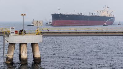 A VLCC or Very Large Crude Carrier docks at the Fujairah Oil Tanker Terminal VLCC Birth 1 jetty in the Port of Fujairah. Opec+ has begun to taper a historic production restriction pact and plans to bring 2 million bpd back to the markets by the end of the year. Antonie Robertson/The National