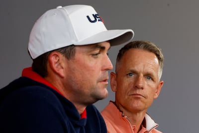 European captain Luke Donald looks on as US counterpart Keegan Bradley speaks. AFP