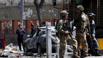 epa07819190 Soldiers of NATO Resolute Support Mission inspect the scene of a suicide bomb attack that targeted a checkpoint, Kabul, Afghanistan, 05 September 2019. According to reports, at least three people were killed and several others were injured in the incident. EPA/HEDAYATULLAH AMID