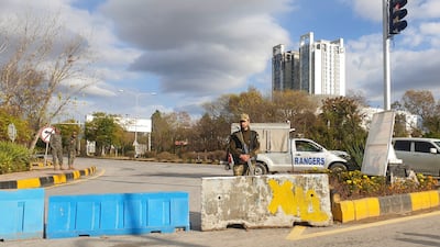Paramilitary forces stand guard at a road junction leading to Murree. Access to the city was blocked after the authorities declared it a disaster zone. Reuters