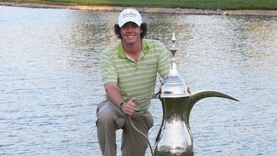 Rory McIlroy with the giant coffee pot trophy after winning the 2009 Omega Dubai Desert Classic at Emirates Golf Club. Jeffrey E Biteng / The National