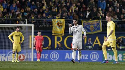 Real Madrid substitute Alvaro Morata, second right, celebrates after scoring the winner in a 3-2 triumph against Villarreal. Miguel Angel Polo / EPA
