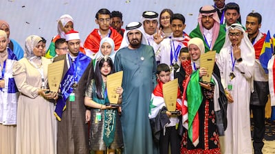 Sheikh Mohammed bin Rashid, Vice President and Ruler of Dubai, with winners of the Arab Reading Challenge, at Dubai Opera. From left, Mohammed Ahmed Hassan from Egypt, Kadi bint Musaffar from Saudi Arabia, Hatem Al Tarkawi from Syria and Salsabil Sawalha from Palestine. All photos: Victor Besa / The National