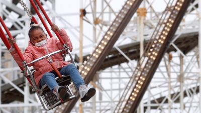 A guest enjoys a ride at Luna Park on the first day of the Coney Island parks reopening, during the coronavirus disease pandemic, in the Coney Island neighborhood of Brooklyn, New York, U.S. Reuters