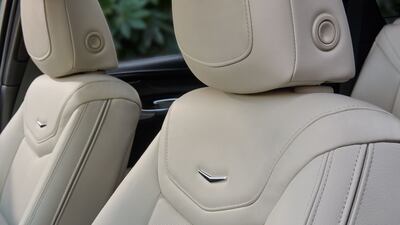 The leather-covered seats feature the signature Cadillac chevron