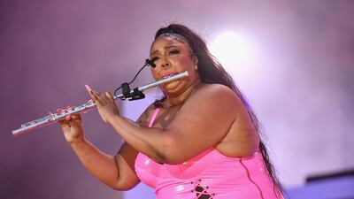 Lizzo shows off her musical talent as part of her performance. AFP