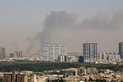 Smoke rises after explosions were heard and air defences activated near the airport in Erbil, capital of Iraqi Kurdistan, last month. AFP