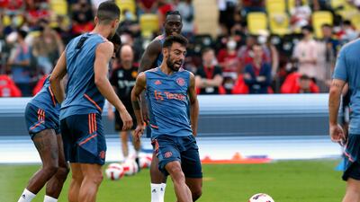 Manchester United's Bruno Fernandes, centre, and teammates during training. EPA