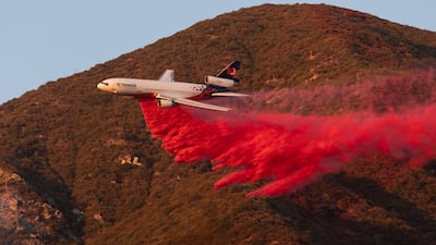 A plane drops fire retardant on the Eaton Fire, near Altadena, California. Bloomberg