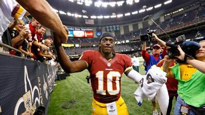 Washington Redskins quarterback Robert Griffin III is congratulated by fans after his side's win over the New Orleans Saints