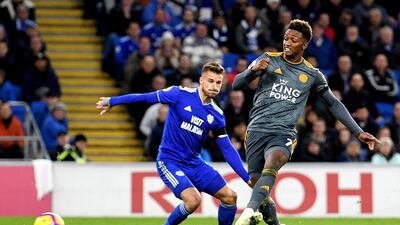 Leicester City's Demarai Gray scores his side's first goal of the game during the English Premier League soccer match between Cardiff City and Leicester City at the Cardiff City Stadium, Cardiff. Wales. AP