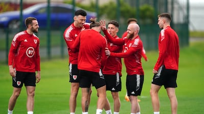 Players share a joke during Wales' training session at The Vale Resort, Hensol. PA