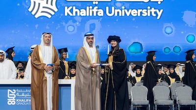 Sheikh Hamed bin Zayed, Chairman of the Crown Prince Court of Abu Dhabi and Abu Dhabi Executive Council Member (second left), presents a certificate to a student during the 2018 Khalifa University Graduation ceremony at the Abu Dhabi National Exhibition Centre (Adnec). Seen with Dr. Arif Sultan Al Hammadi, Executive Vice President of Khalifa University.