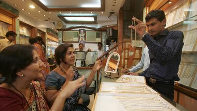MUMBAI, INDIA MARCH 11, 2008: Gold and Jewellery - Rekha Sanghvi (L) and Santosh Jain at Umedmal Tilokchand Zaveri jewellery shop at Zaveri Bazaar. Salesmen wait for the customers at their shop on Tuesday as there are less buyers nowadays as gold prizes soared up in last few days. (Photo by Santosh Harhare/Hindustan Times via Getty Images)