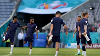 Kingsley Coman, left, and Kylian Mbappe talk during a team training session at Allianz Arena. AP