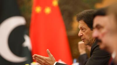 Pakistan's Prime Minister Imran Khan (2nd R) attends talks with China's President Xi Jinping (not pictured) at the Great Hall of the People in Beijing. AFP
